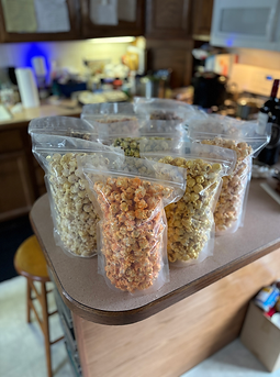 Butta Popcorn gourmet popcorn assortment ready to share at a holiday family gathering.