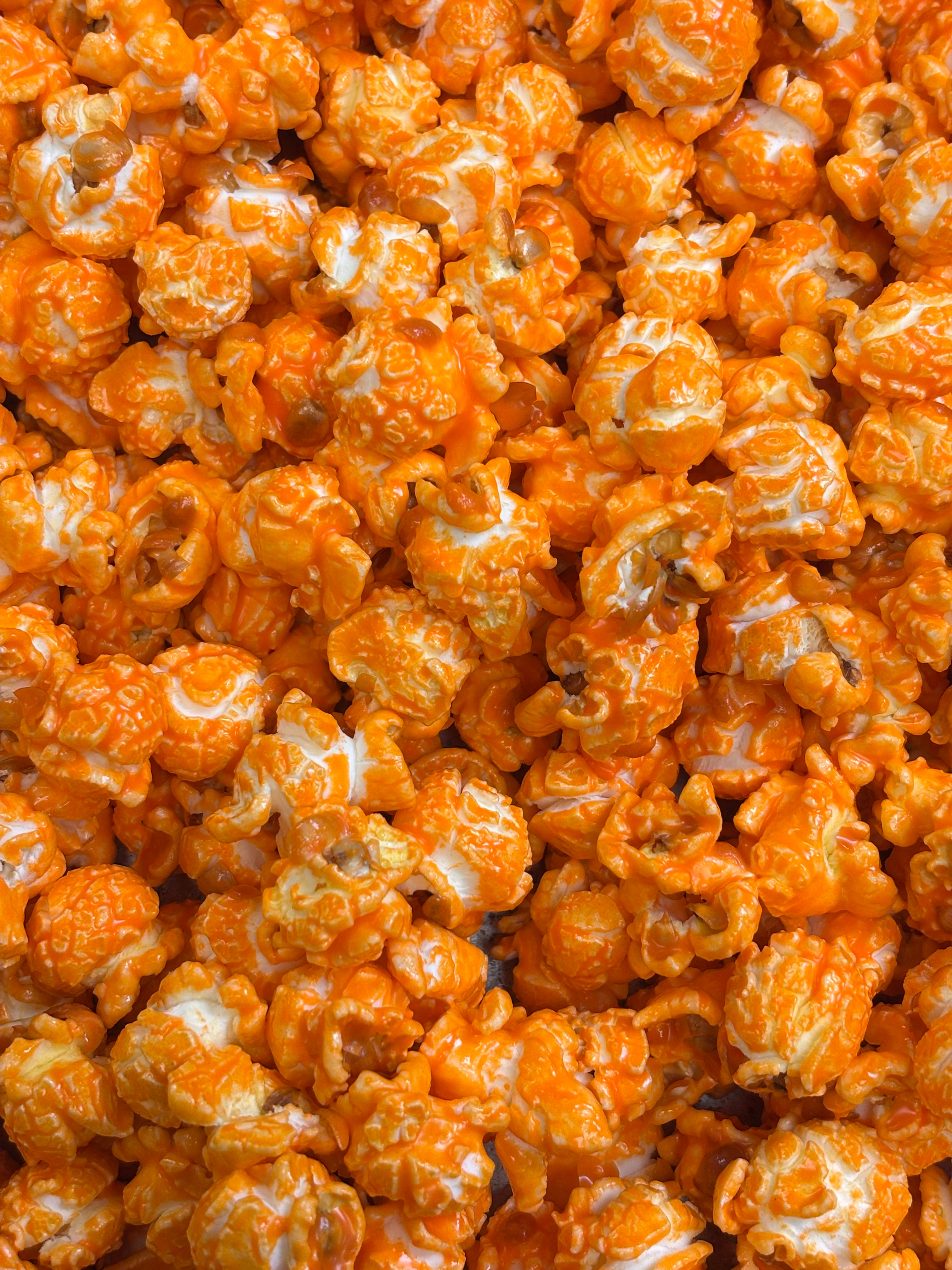 Velvet Cheddar Melt Popcorn with rich buttery cheddar seasoning.