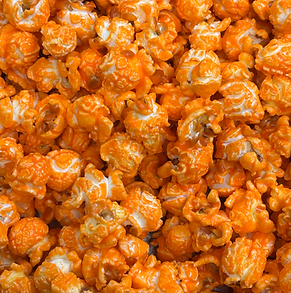Close-up of Butta Popcorn's Velvet Cheddar Melt gourmet popcorn.