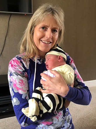 Doula Susan Gibson Holding a Baby