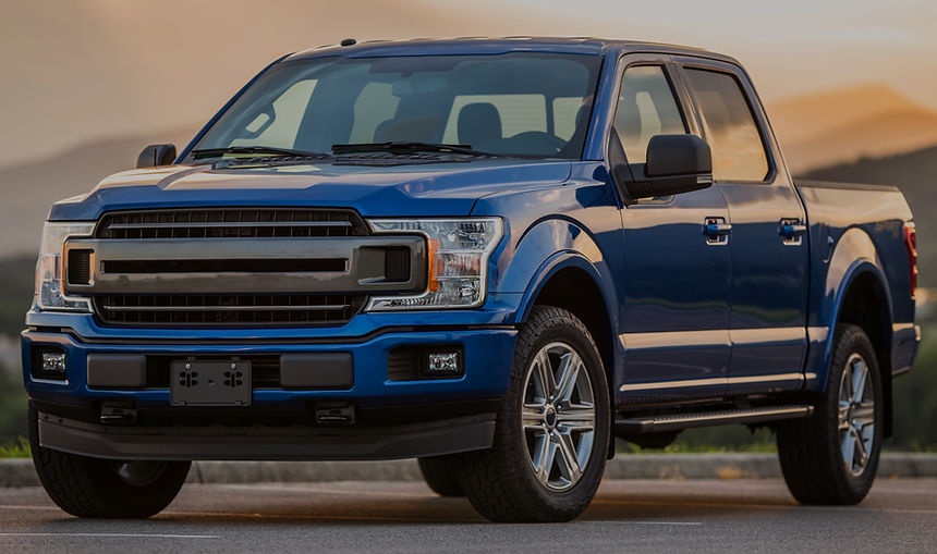 Blue pickup truck representing mobile service for light-duty vehicles