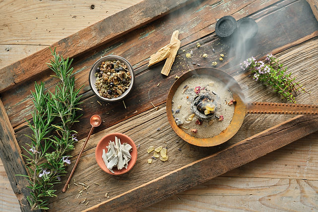 Burning incense on charcoal in an old rusty censer on a rustic wooden tray – incense resin
