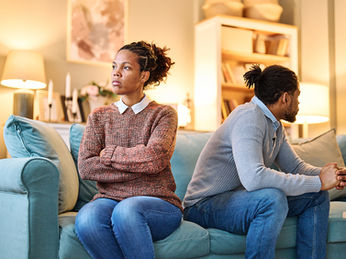 Upset Couple Sitting Apart on Couch