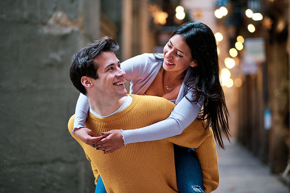 Smiling Woman on Man's Back in City Street
