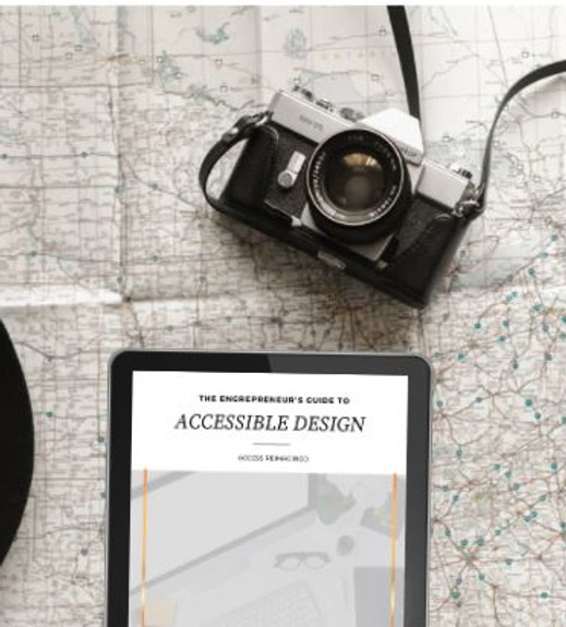 A camera and tablet sit on a map. The tablet screen has the cover of "The Entrepreneur's Guide to Accessible Design".