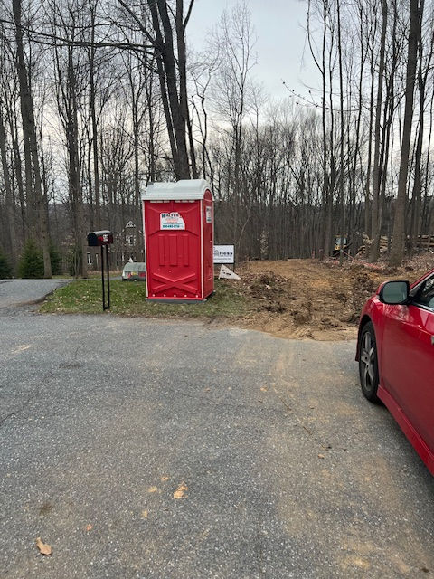 A red porta potty to match Craig's red car!
