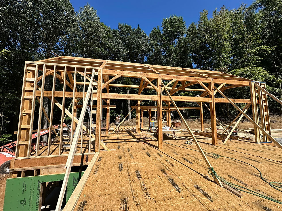 First the load-bearing walls were framed around the timber frame.