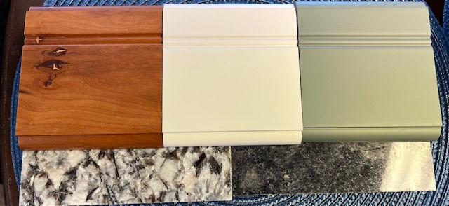 Natural Cherry for the kitchen, hutch, entertainment center, granite white for the bathrooms, green for the pantry. You can see our granite selections in the background: Lennon and Steel Gray.