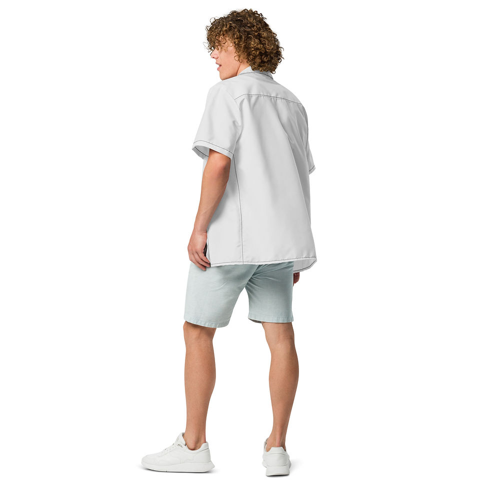 Miniature : Man wearing a white shirt and shorts looking away wearing white shoes.