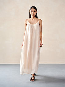 Woman in a pale pink maxi dress
