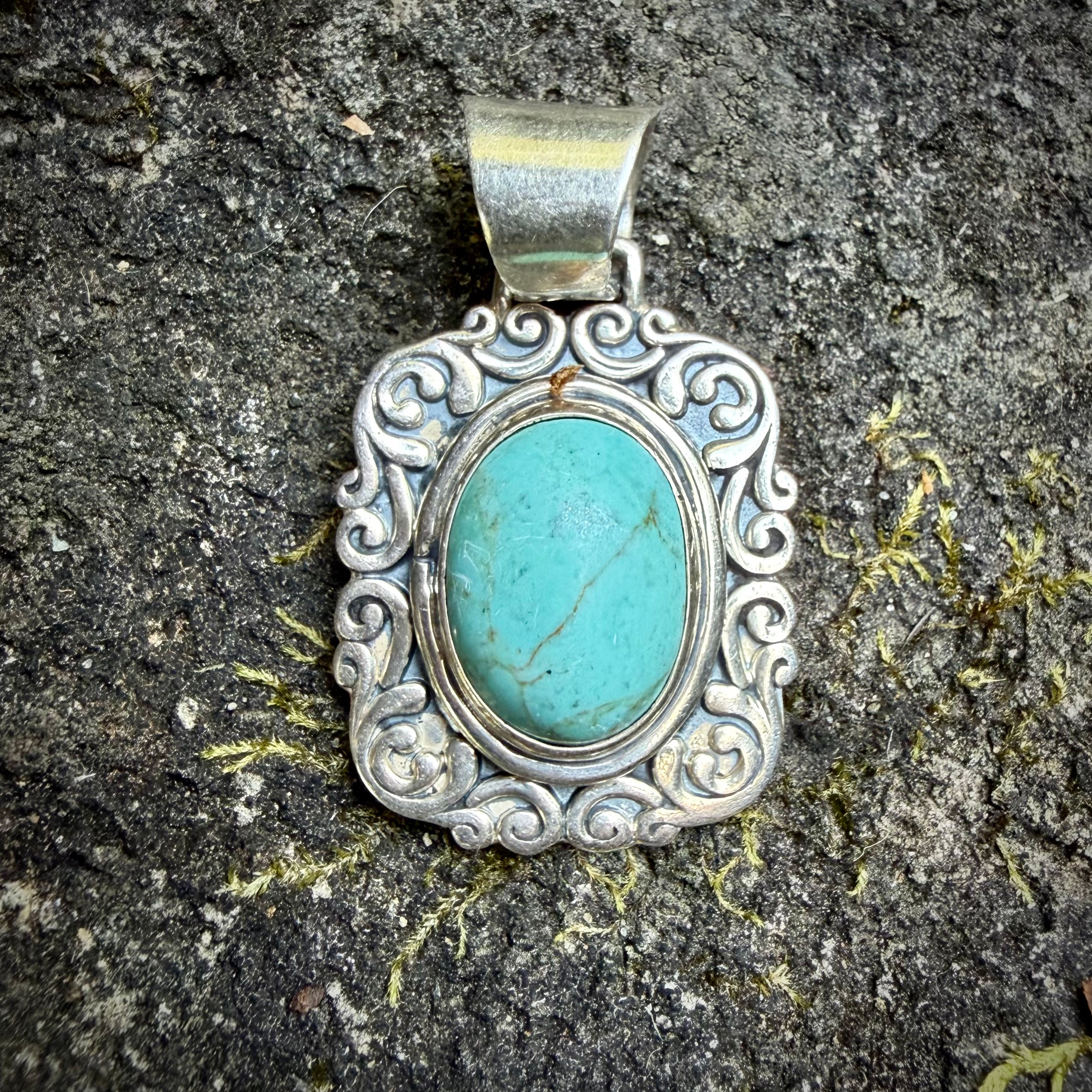 Sterling silver and turquoise color stone pendant 