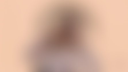 Woman in glasses, pink hoodie, lively pose on peach background. Text: "Marketing burnout is 100% real." Branding Momentum logo.