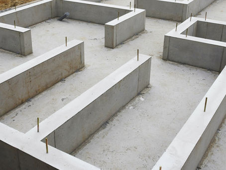 A home in the middle of construction. The foundation is laid out, highlighting the home's structure.