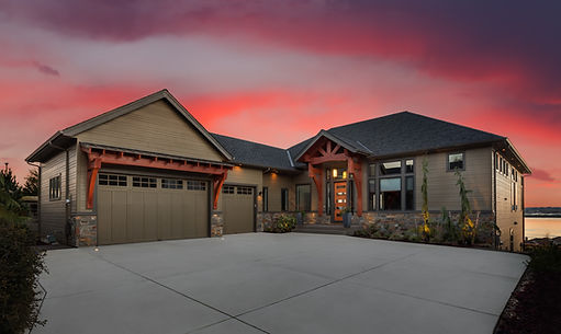 Beautiful residential home with sunsetting in the background.