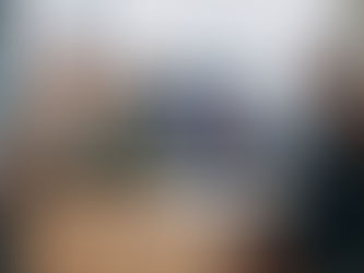 Couple with car keys at the dealership