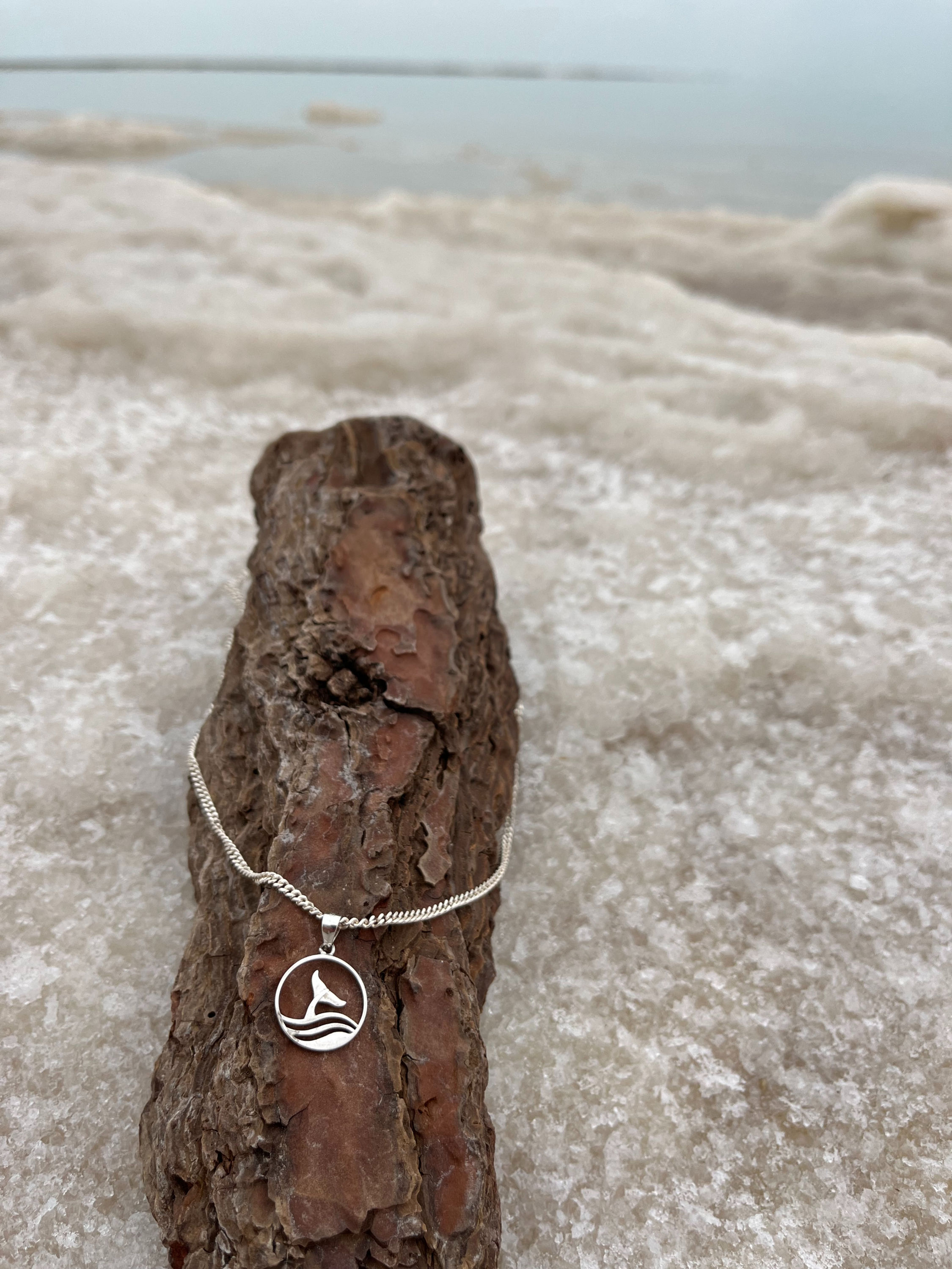 Sterling silver whale tail necklace with ocean-inspired design