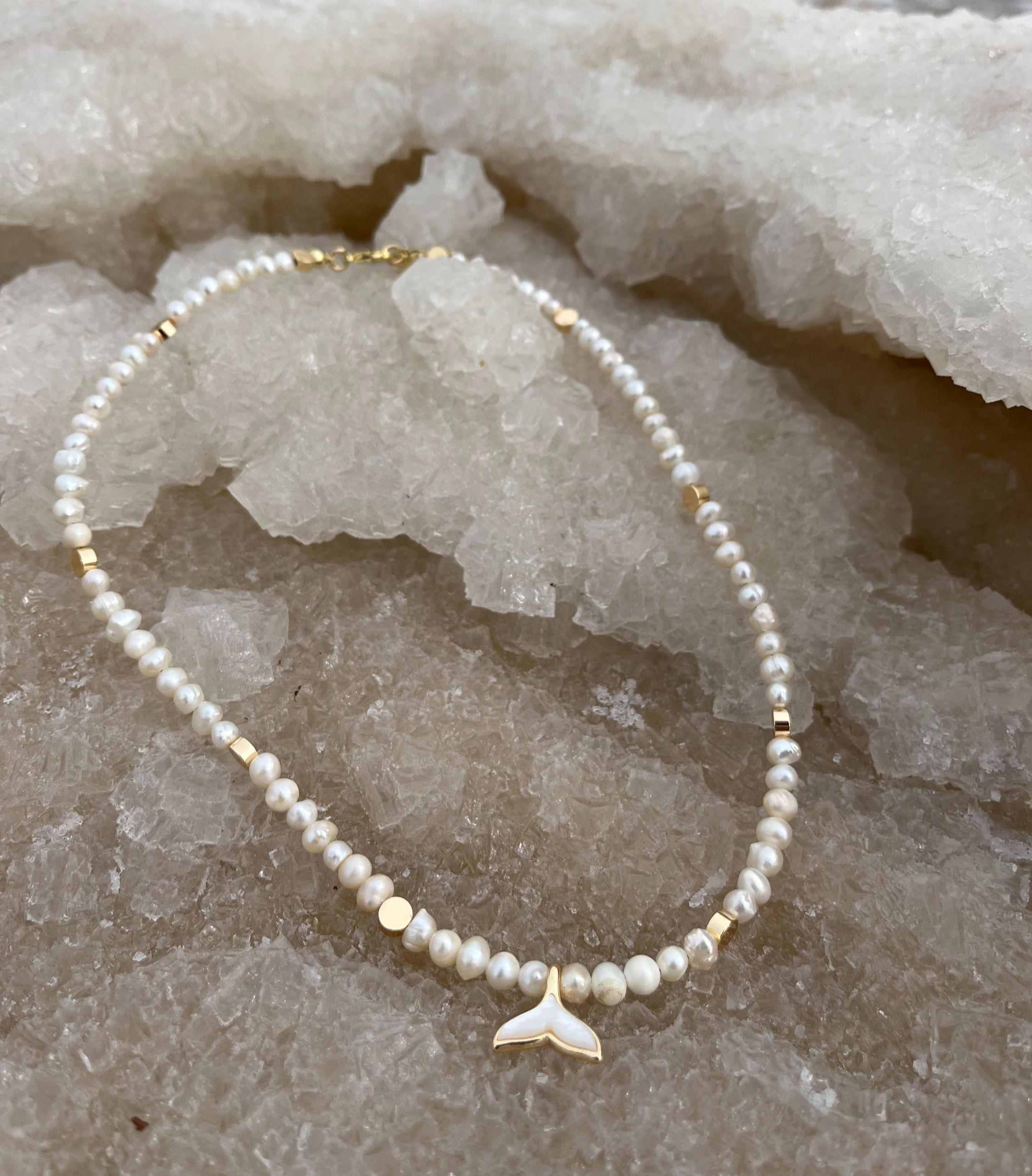 Pearl necklace with gold-plated details and a natural shell whale tail pendant, ocean-inspired jewelry