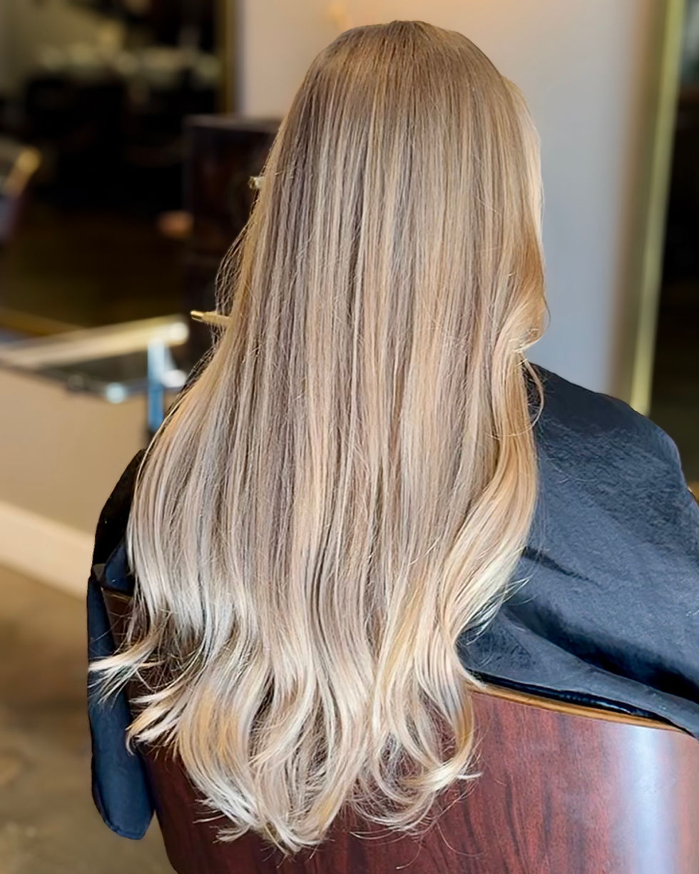 Lived-in blonde hair painted with balayage