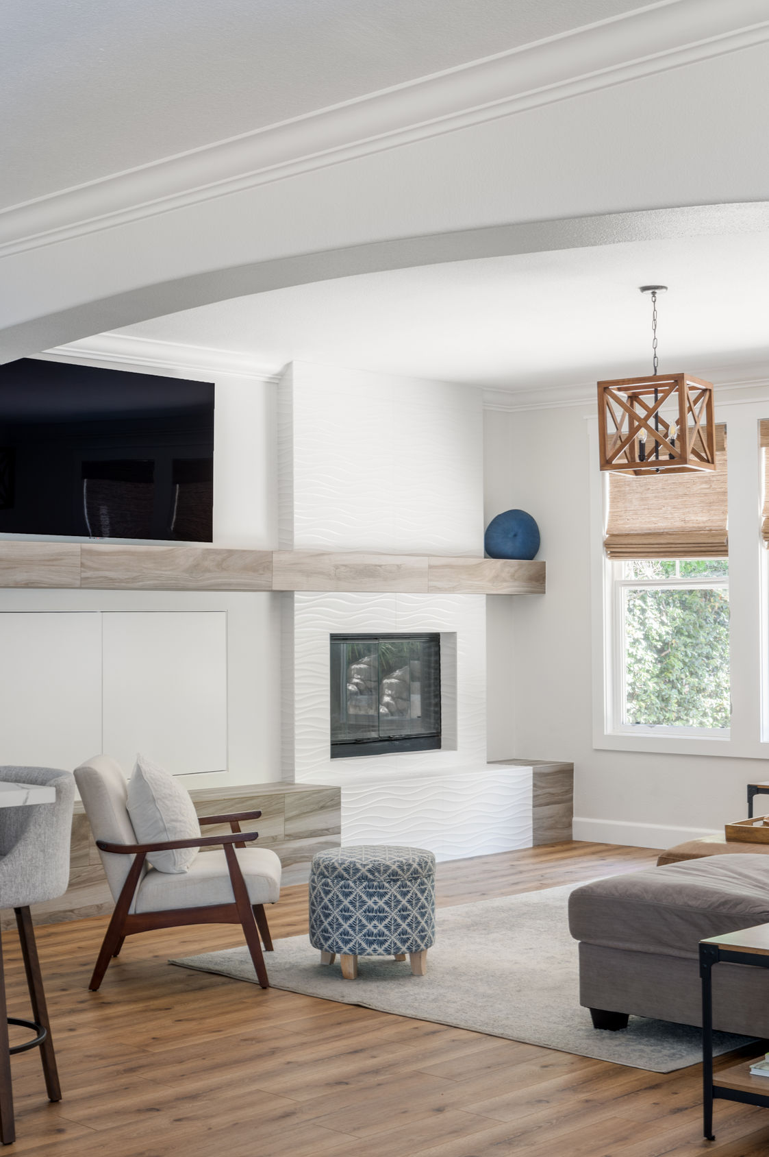 Modern living room with fireplace and wood mantel