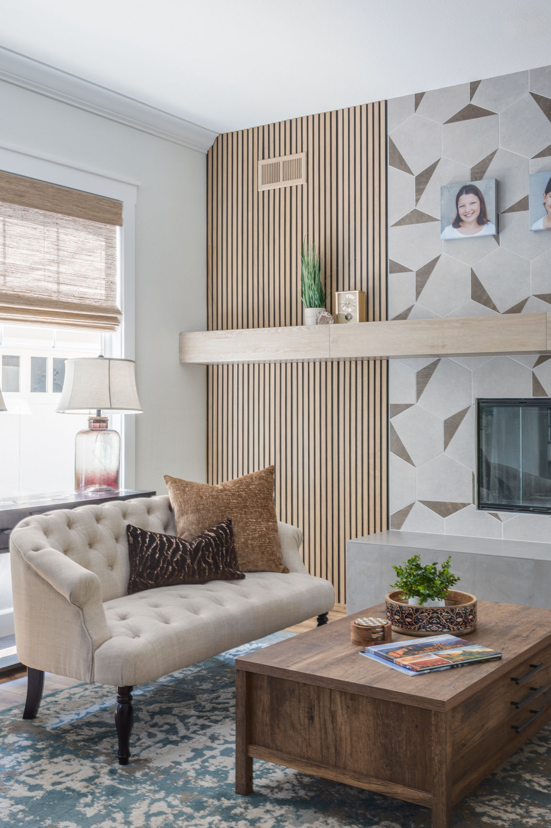 Modern living room with neutral love seat and wood coffee table.