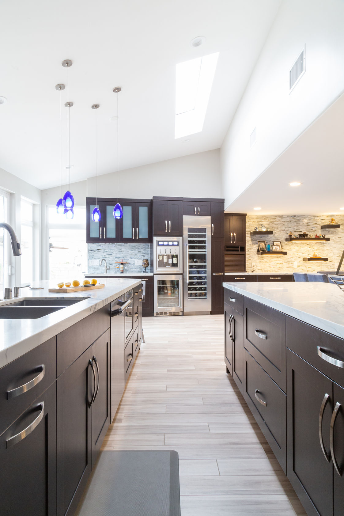 Modern kitchen with dark wood cabinets and white counters