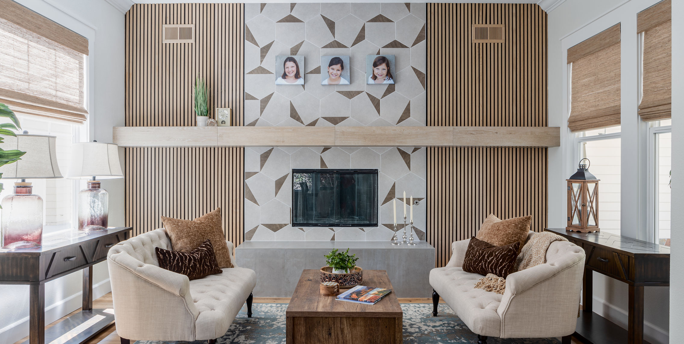 Modern living room with geometric fireplace and cream sofas