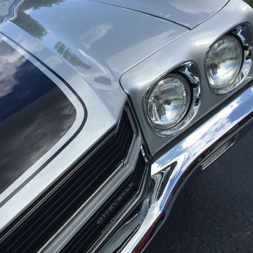 A Vintage Muscle Car With Customized Paint & Other Features