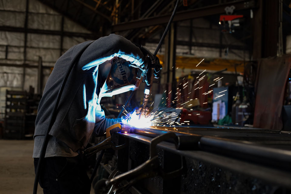 A Welder Welding Metal Parts