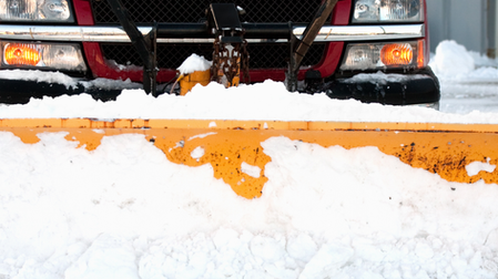 A Commercial Winter Storm Management Company Plowing Snow