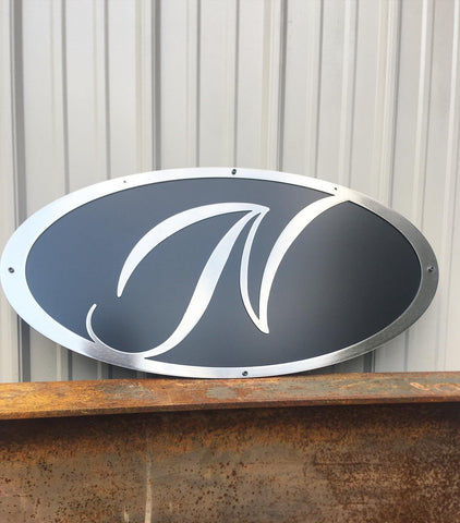 A Metal Oval Sign