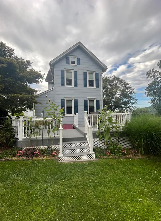 Professionally Pressure Washed & Painted Home Exterior Siding Completed by Our Exterior House Painting Contractors