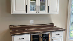 Custom walnut bar top featuring a luxury caviar resin pour