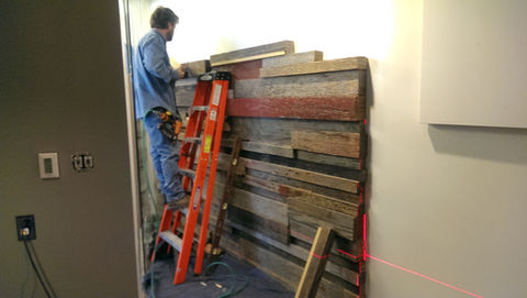 A Wooden Accent Wall Being Installed by Our Woodworker