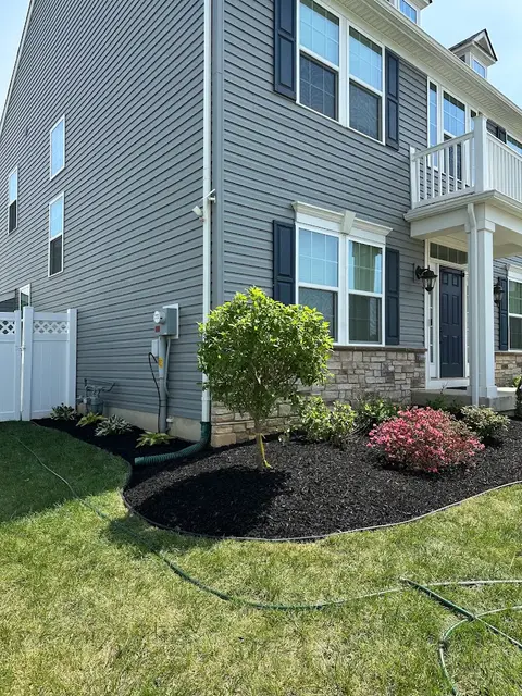 Fresh Black Mulch Installed in Front of an Allentown House