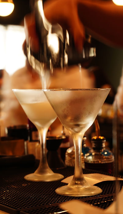 A Bartender Mixing Up Some Martinis