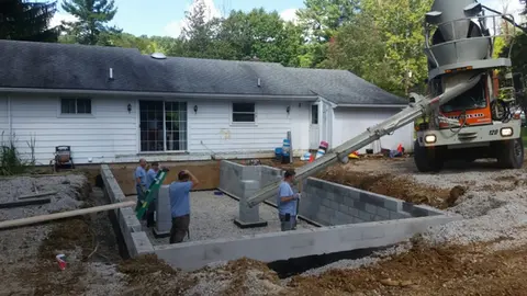 Our Crew Pouring Cement for a Concrete Floor