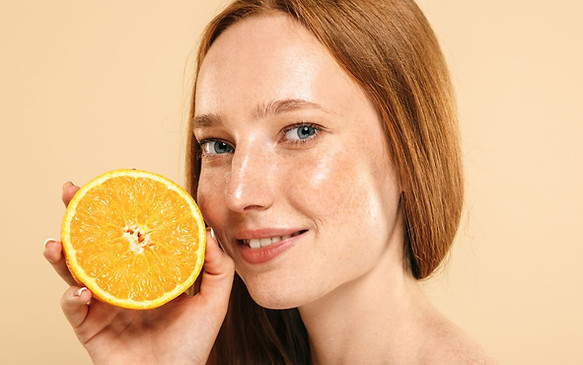 Woman Holding an Orange