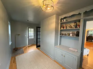 Residential Cabinets Painted to Match the Same Color as a Home's Interior Walls