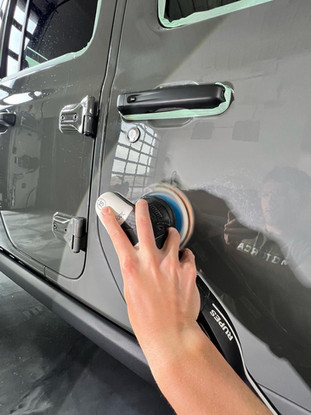 Auto Detailer Buffing Out Scratches