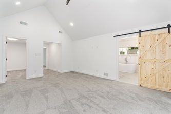 A Bedroom With a Sliding Barn Door