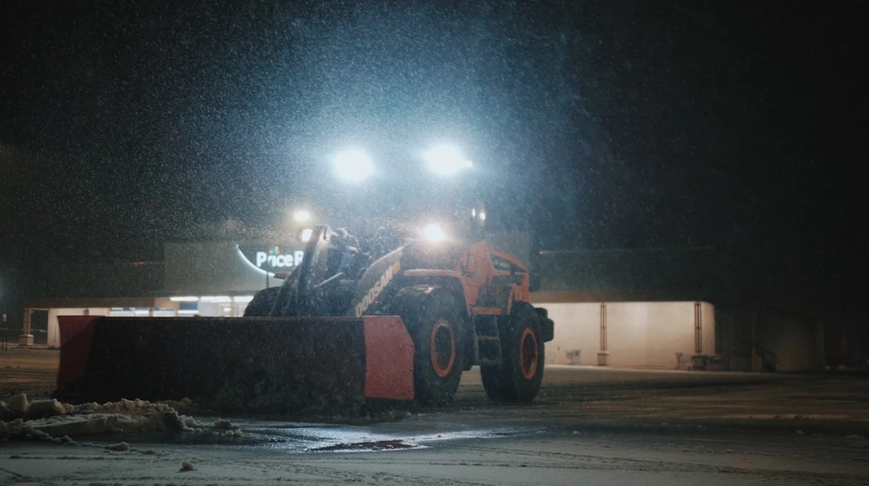 Snow Removal Contractors Cleaning Up After a Blizzard