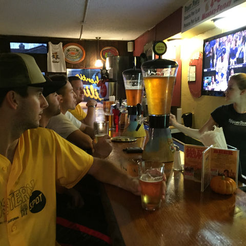 Patrons Watching the Game & Enjoying Some Brews