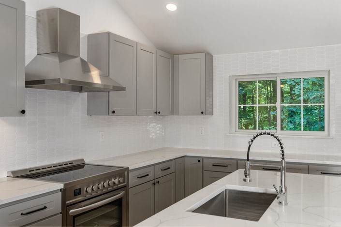 Custom Cabinetry, Stainless Steel Appliances, & a Kitchen Island