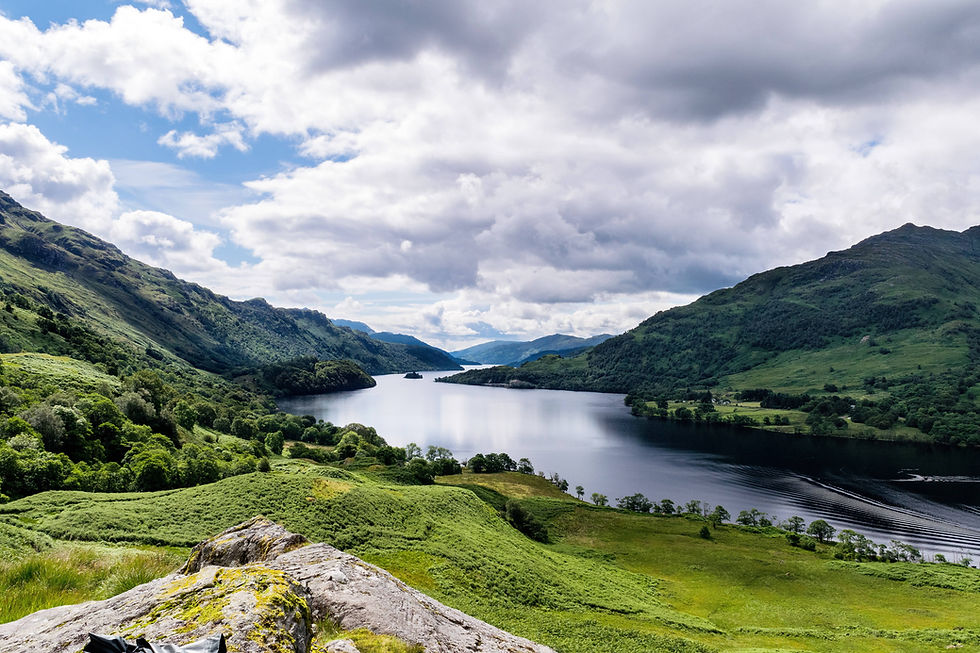 Beautiful landscape with a river and mountains surrounding it.