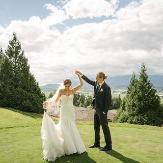 A picture of the bride and groom dancing for a photoshoot