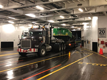 909 John Deere on a Railbed Hual. Getting on the ferry. Hauled from Duncan to Radium Hot