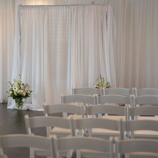 An image of an indoor wedding seating arrangement