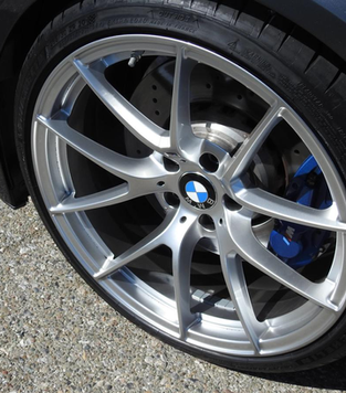 A picture of a wheel of a BMW car.