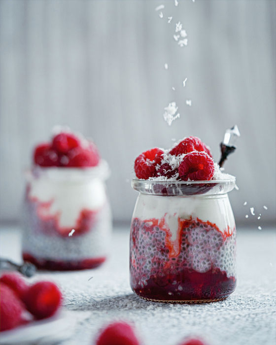 Two jars of chia pudding with berries