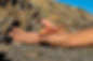 closeup-man-holding-tiny-red-crab-his-palm-cliff-surface_FPK.jpg